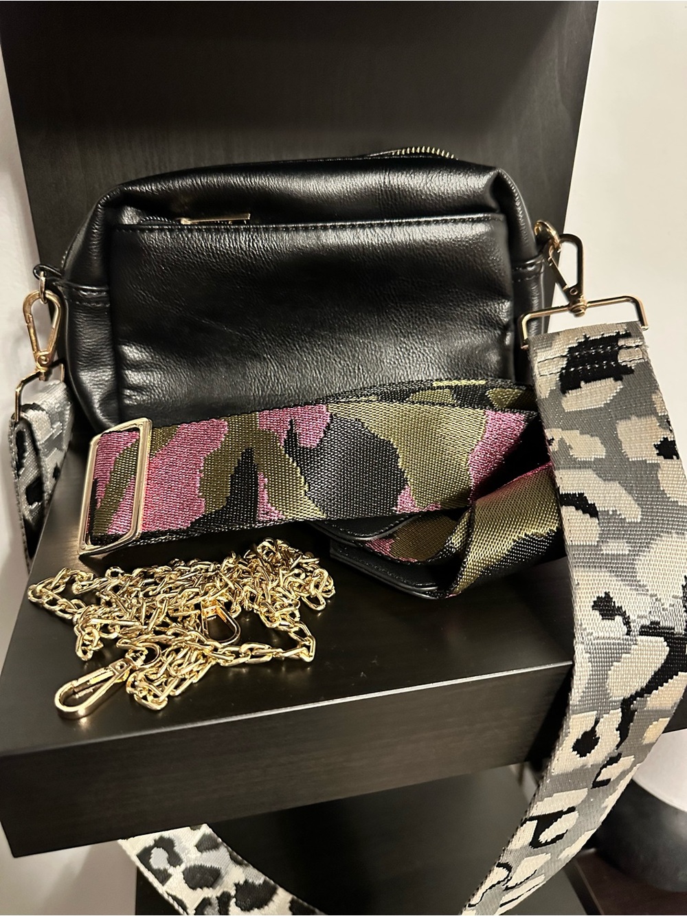 Black Leather Crossbody Bag with Gold Chain and Two Camouflage Straps